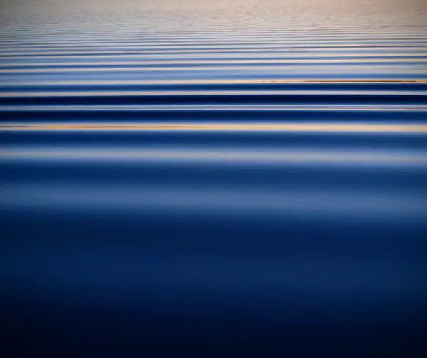 Abstract smooth water ripples on Lake Superior, deep blue
